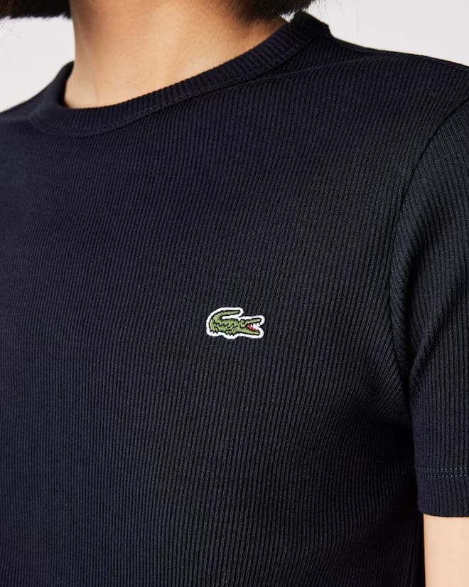 
                      
                        T-Shirt Lacoste de couleur Marine F.
                      
                    