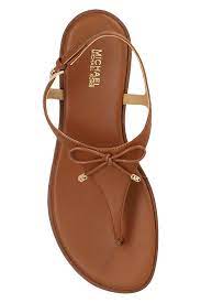 
                      
                        Michael Kors Nori Flat Sandal in Tan color
                      
                    